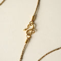 Collar sarta africana y serpiente infinito bronce
