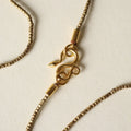 Collar sarta africana y serpiente infinito bronce
