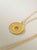 Collar Medallon Elementos dorado