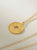 Collar Medallon Elementos dorado